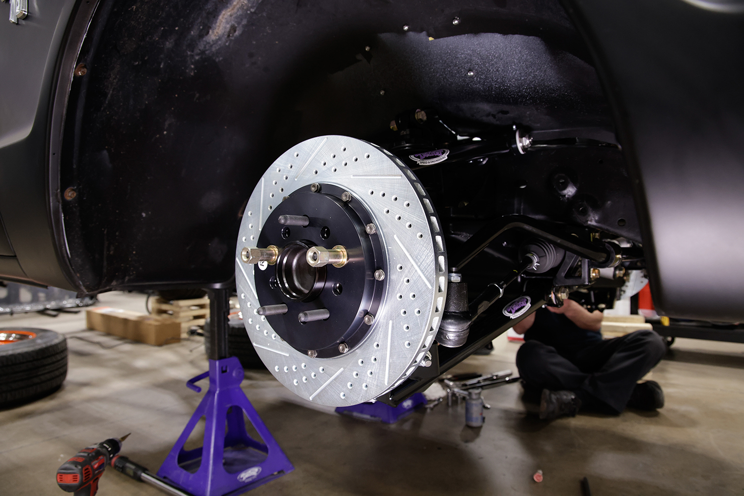 26 Drilled and slotted brake rotor installed on the DSE Chevy C10 front suspension for optimal stopping power