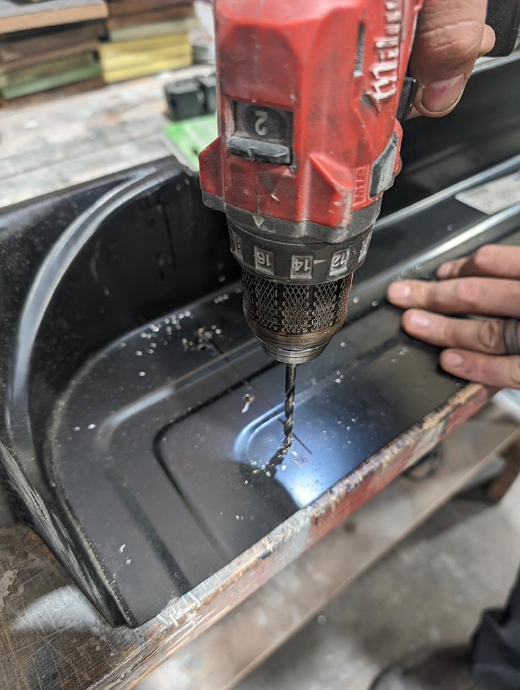 26 Drilling mounting holes on black replacement panel for 1966 Chevy truck door restoration