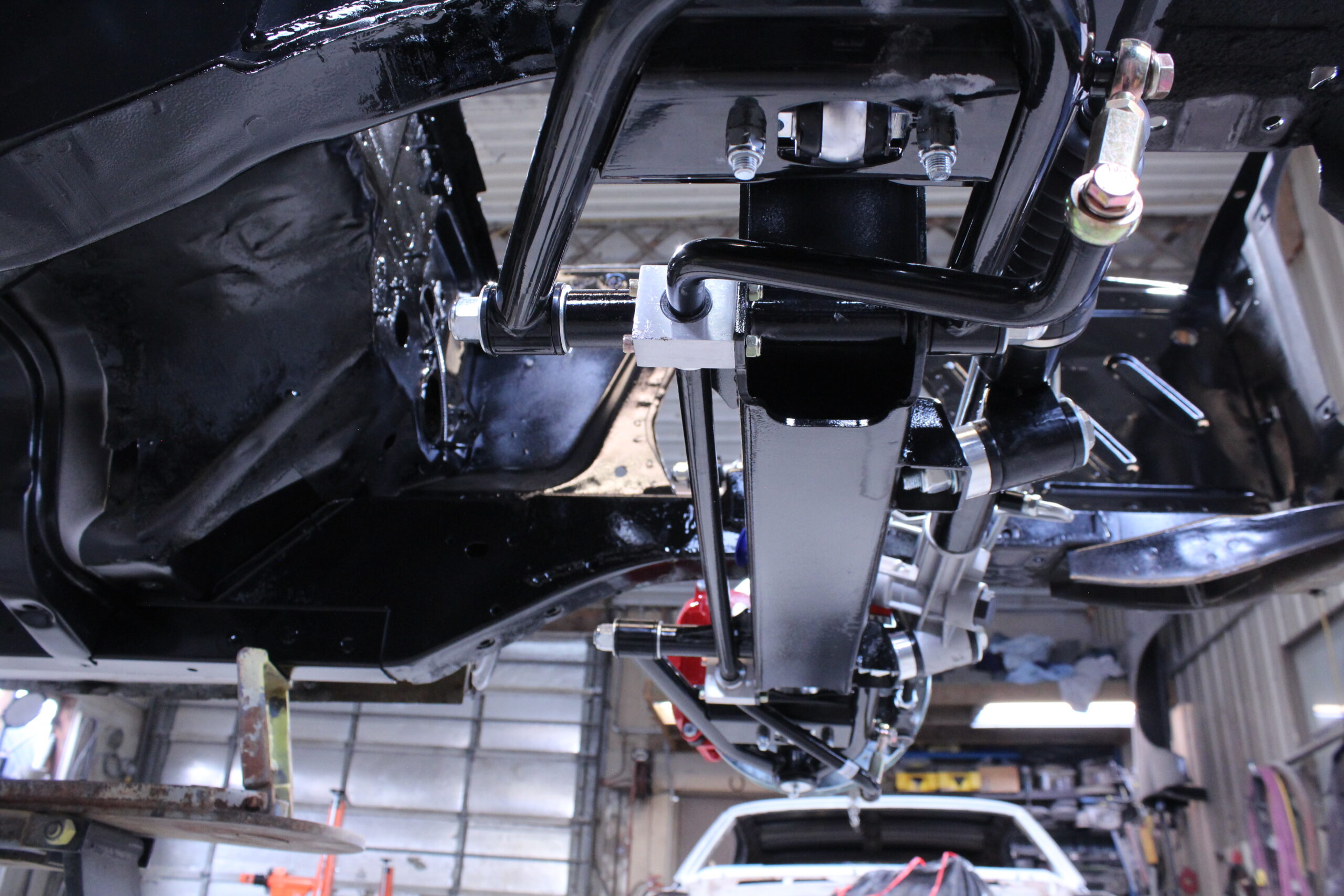 29 Close up of the installed sway bar and steering rack upgrade on the 1965 Mustang chassis