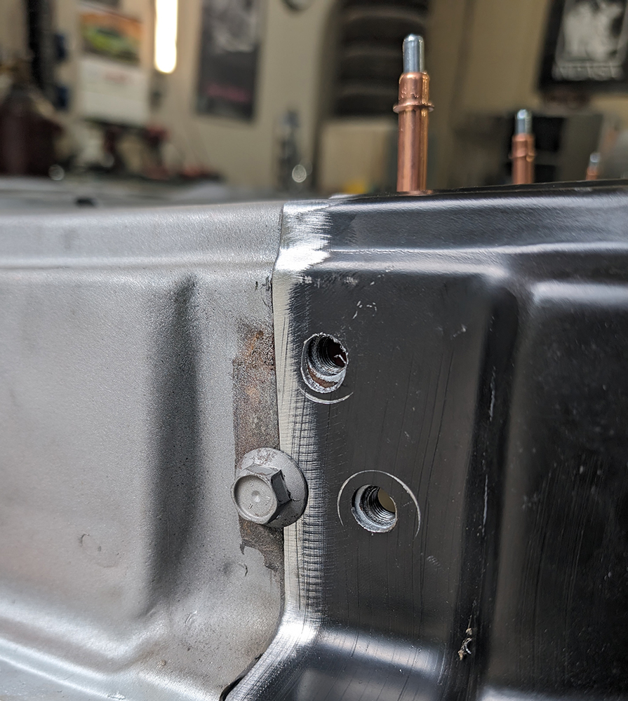 30 Close up of Cleco fasteners aligning replacement panel on 1966 Chevy truck door