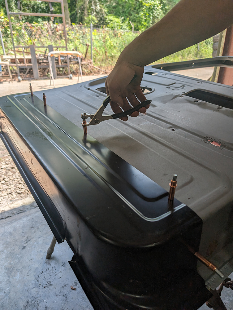 31 Securing panel alignment with Cleco clamps on 1966 Chevy truck door skin
