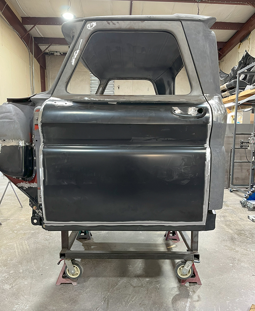 45 Completed 1966 Chevy truck door fitted on the cab showing aligned bodywork
