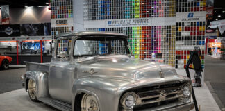 01 1956 Ford F100 polished silver custom at SEMA 2024 featuring chrome accents and slammed stance