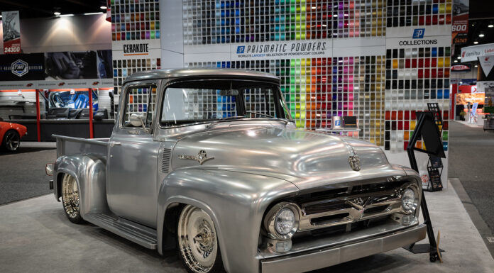 01 1956 Ford F100 polished silver custom at SEMA 2024 featuring chrome accents and slammed stance