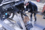 Replacing the Floor on Your 1964-68 Mustang 01 1965 Ford Mustang interior stripped technician cutting and repairing damaged floor pan for restoration