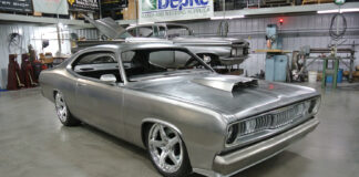 01 Custom 1971 Plymouth with a raw metal finish aggressive stance and polished five spoke wheels