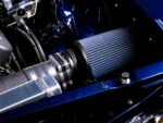 011 1966 Chevy Chevelle engine bay featuring a high performance intake and polished aluminum components