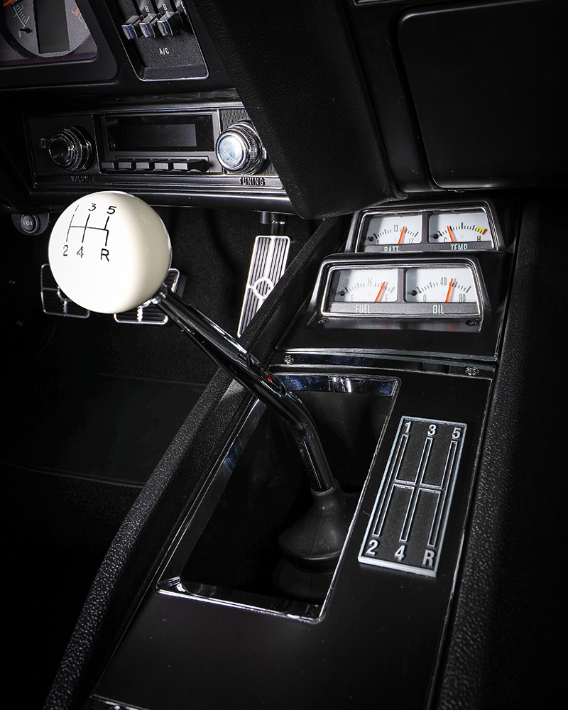 012 1969 Chevy Camaro center console with manual shifter and retro gauges