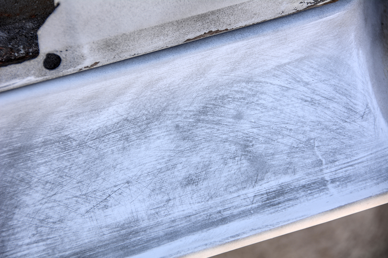 020 Close up of a sanded surface showing the texture left after fiberglass repair and primer application