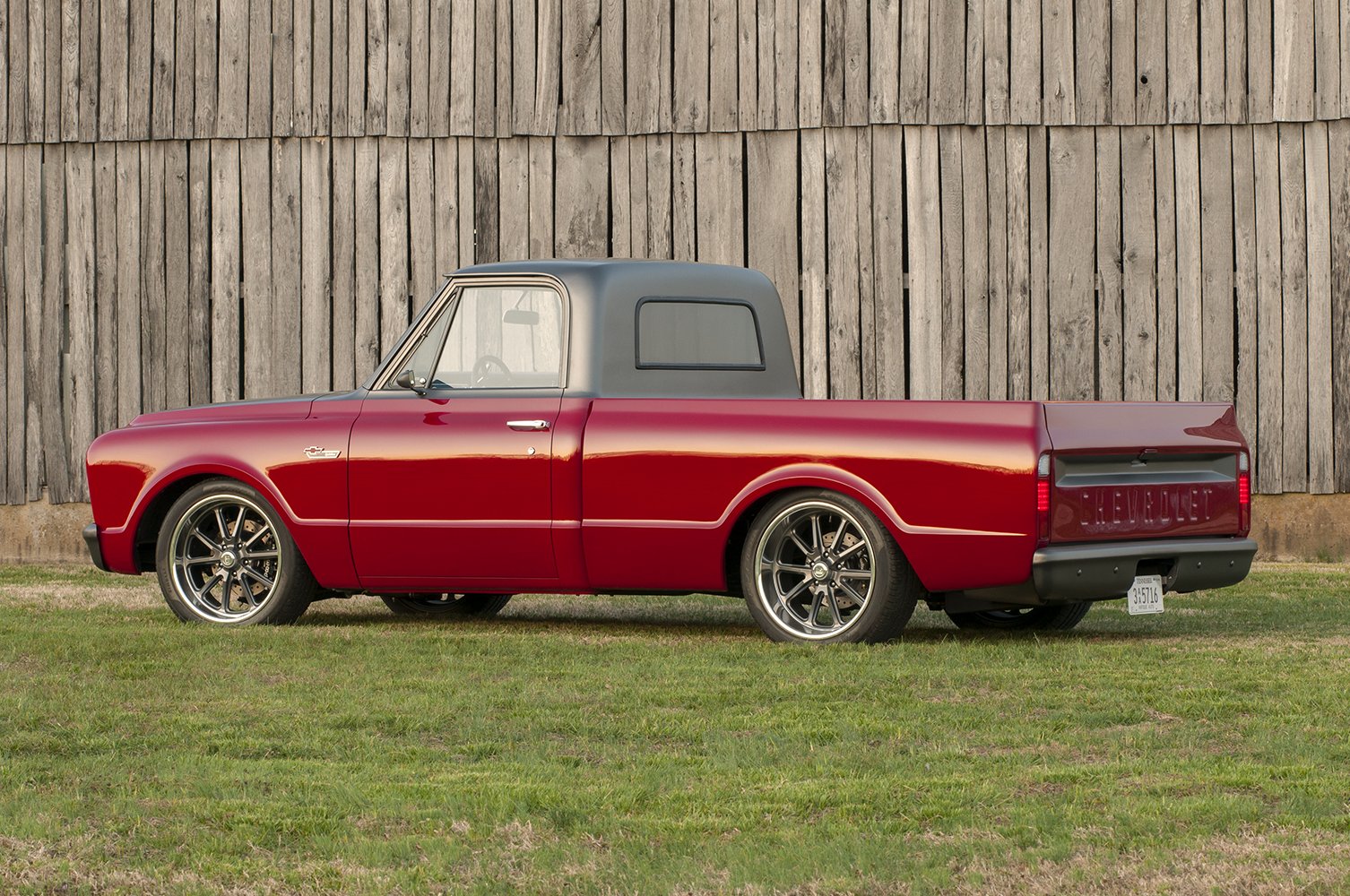 03 Side profile of the 1967 Chevy C10 highlighting its sleek body lines and contrasting gray roof 1