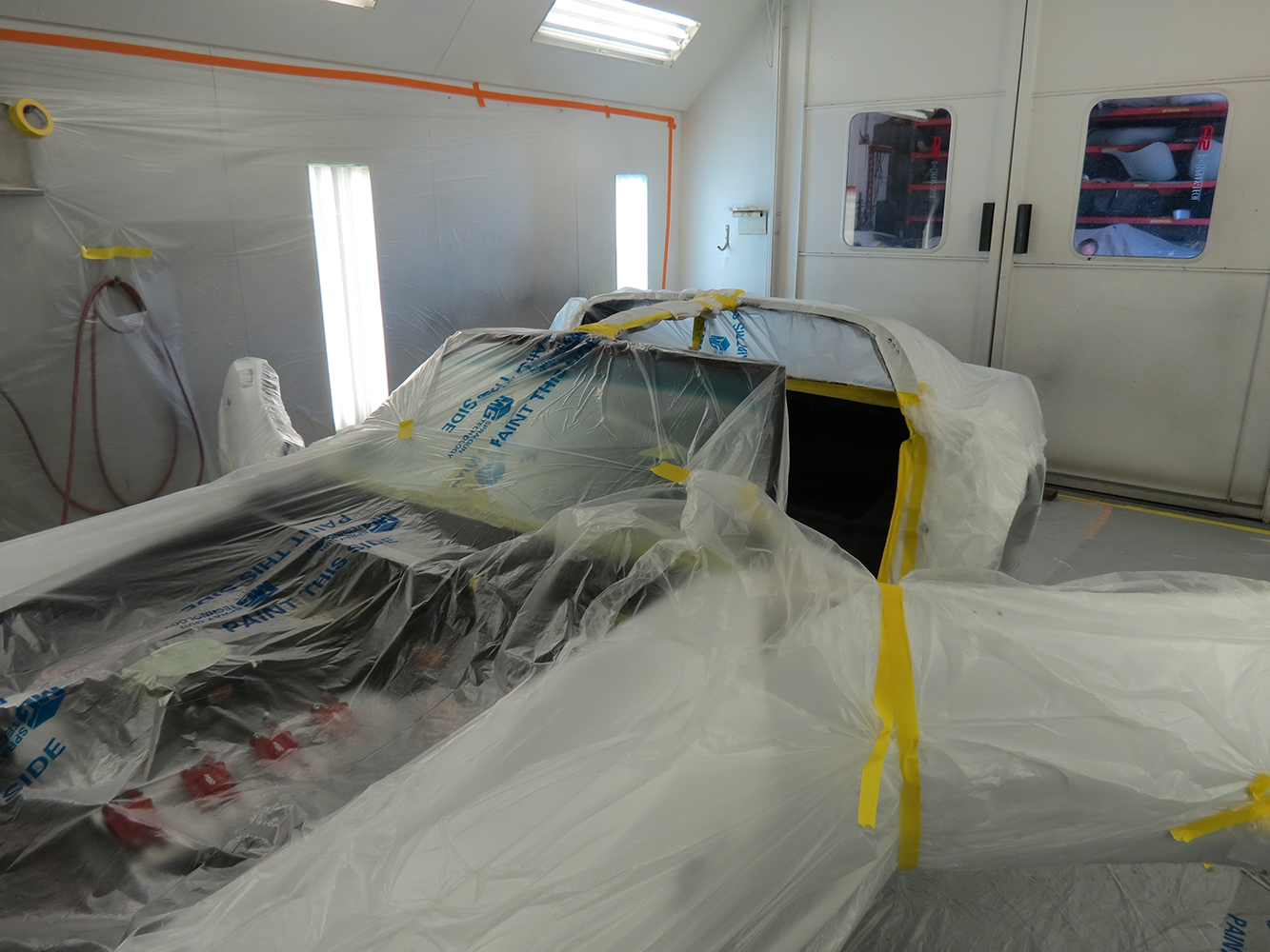 04 Corvette prepared for paint and coating application fully masked and staged in the paint booth