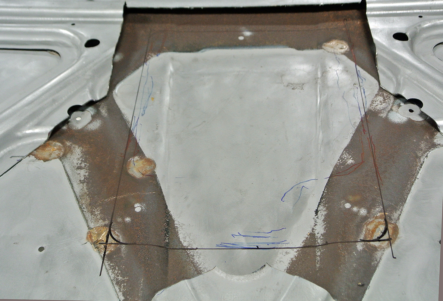 05 Close up of rust repair and outlined markings on the 1971 Plymouth hood metalwork