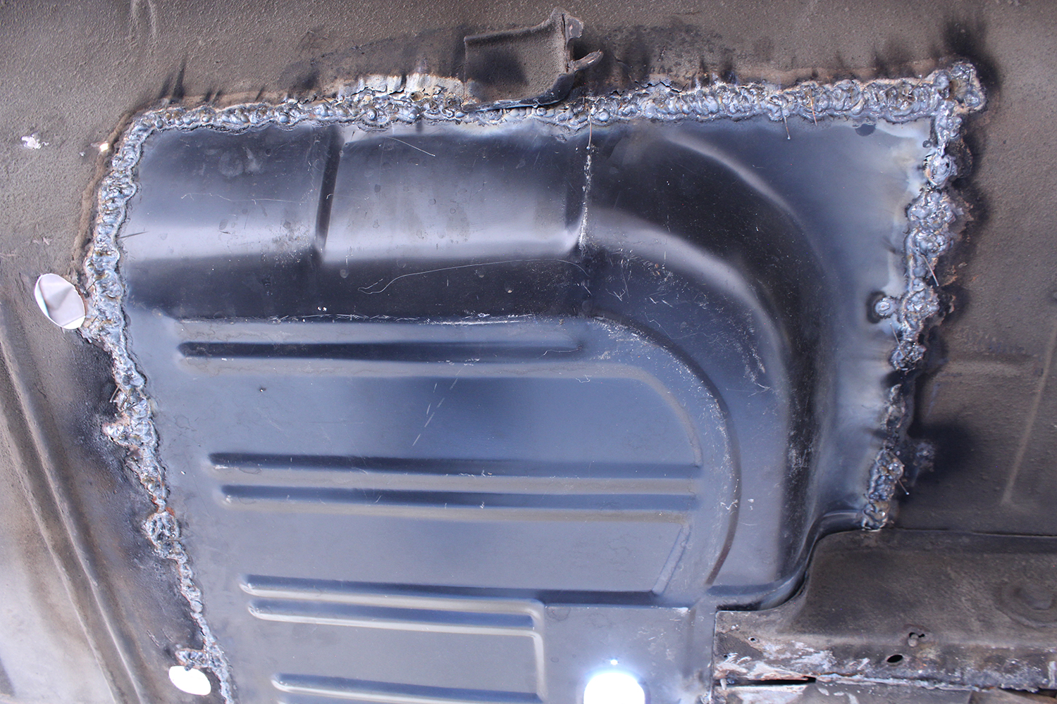 07 Completed floor pan welding on 1965 Ford Mustang detailed seams and solid black finish