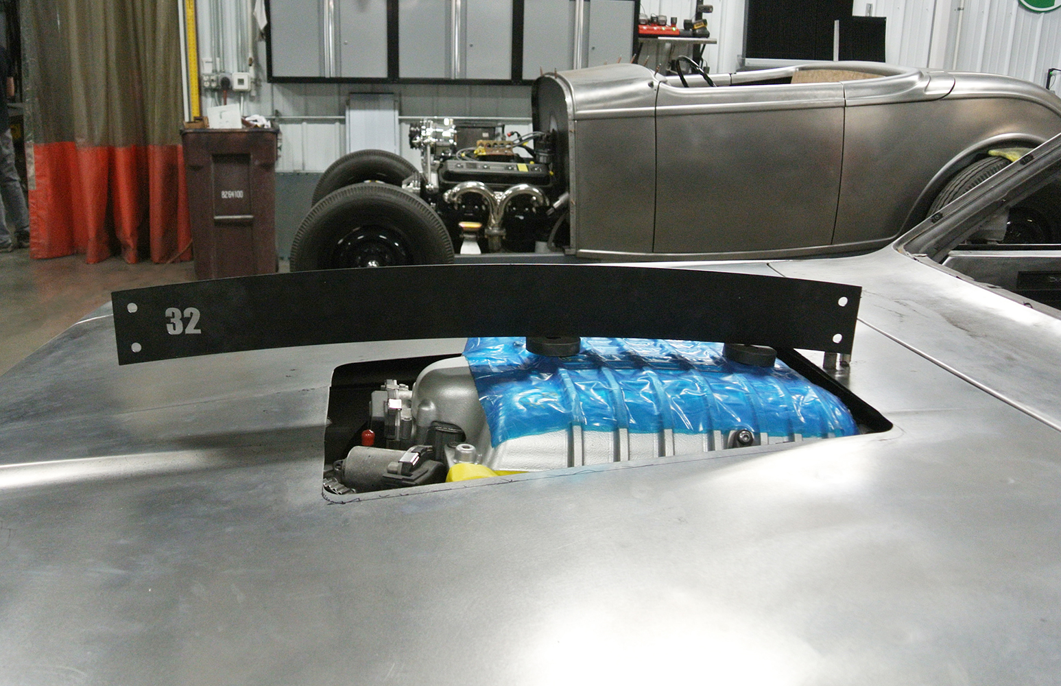 07 Rear view of a 1971 Plymouth hood highlighting smooth metal fabrication and structural braces