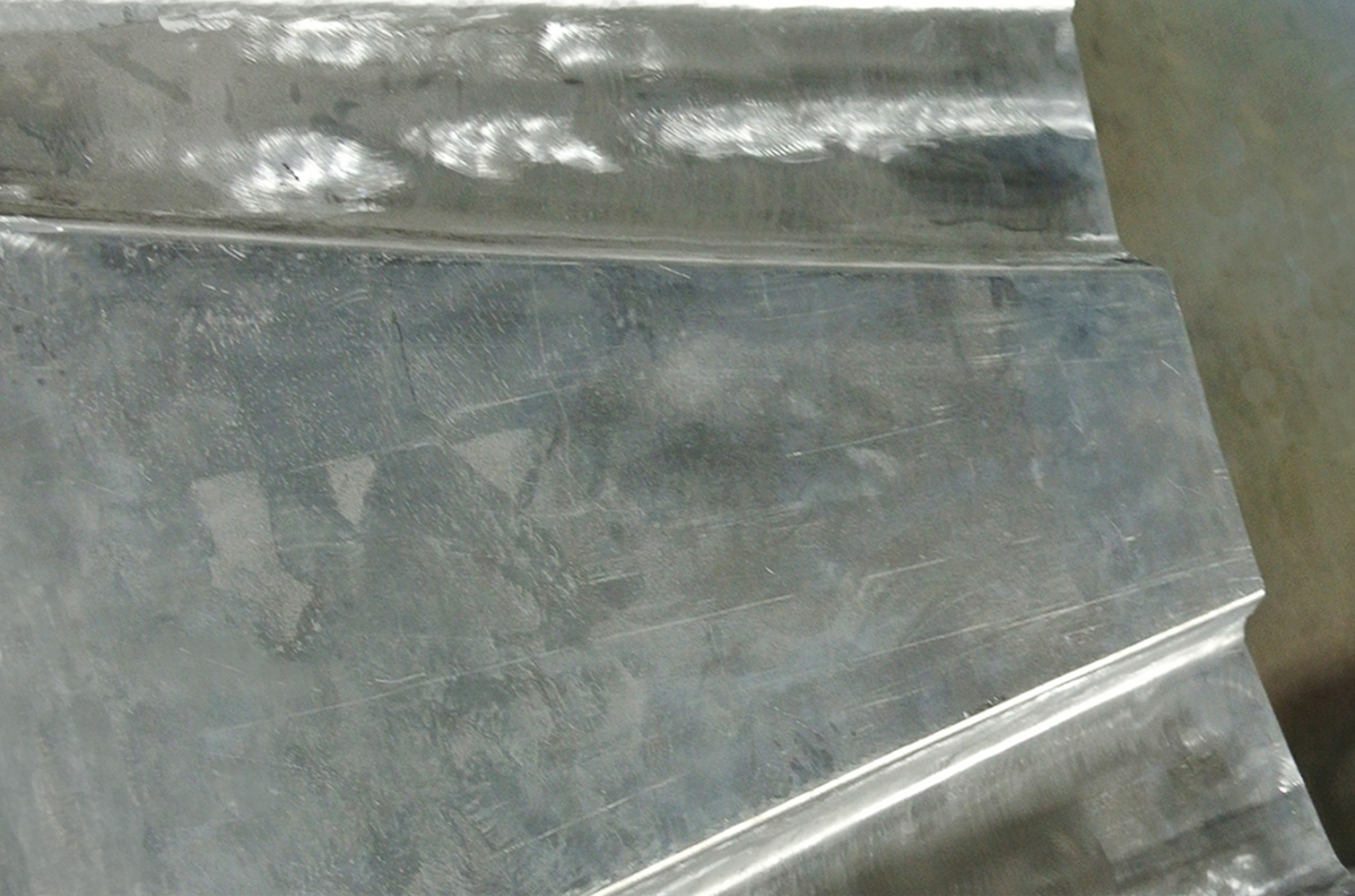 09 Close up of a smoothed brushed metal section possibly a panel or trim piece for the build