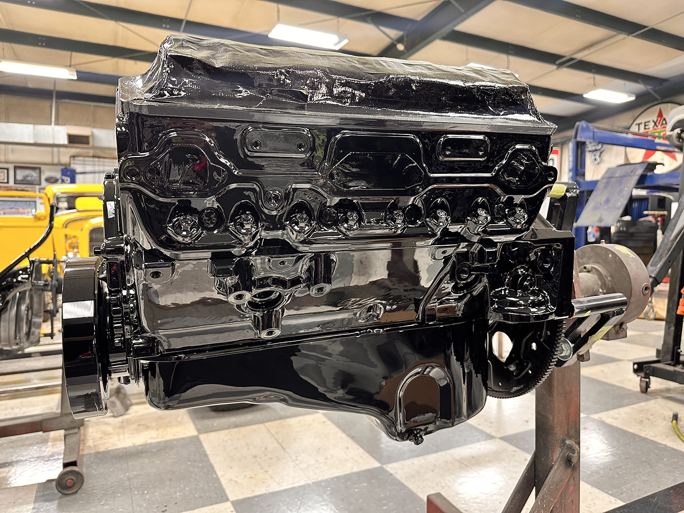 10 Engine block coated in glossy black paint enhancing its appearance for a high performance restoration