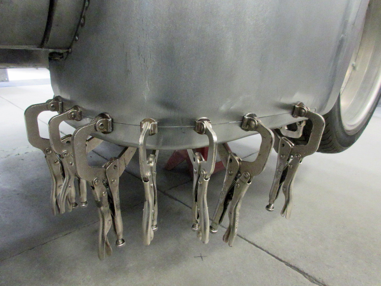 12 Ford F100 cab corner clamped for welding during fabrication