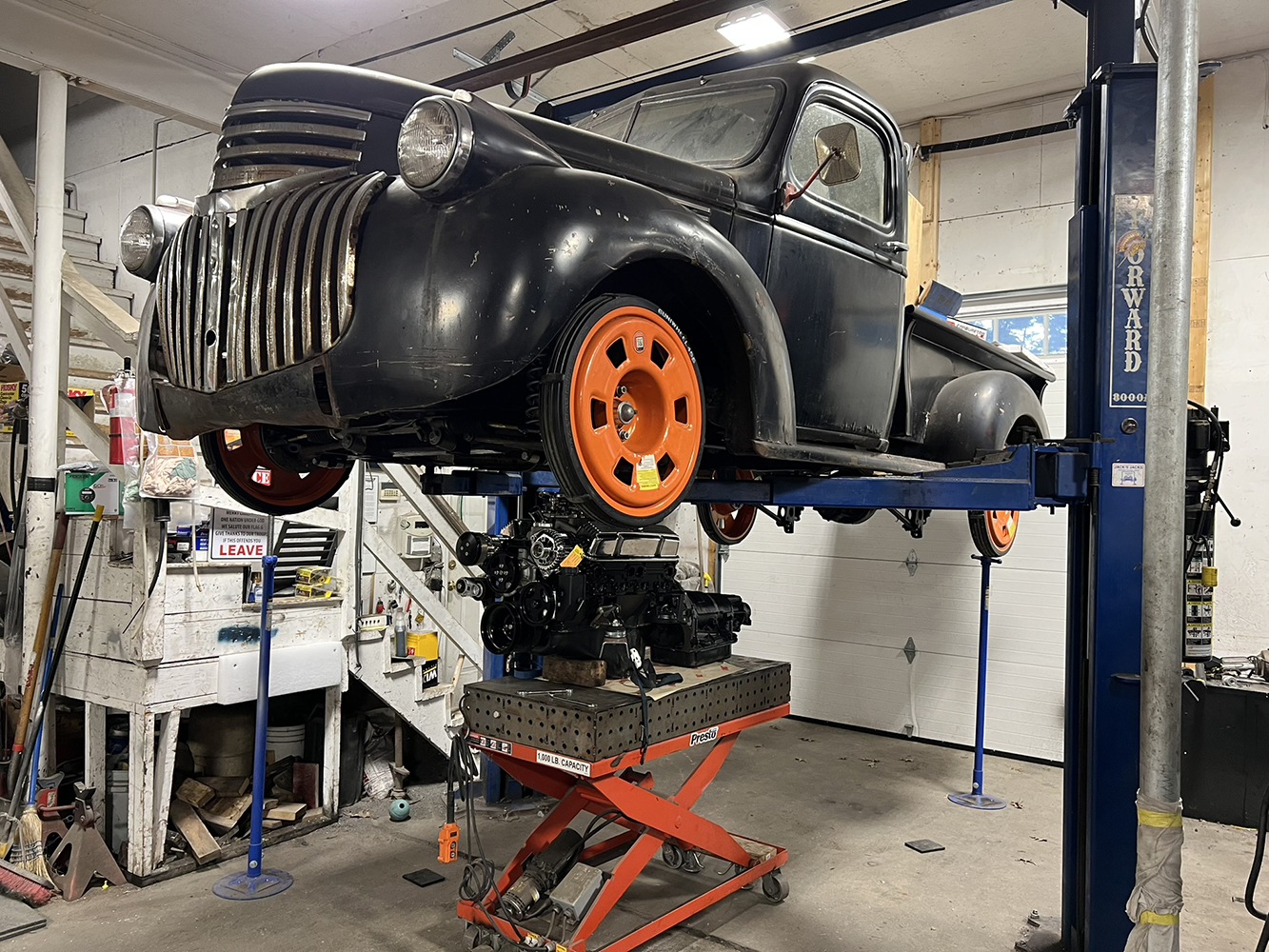 13 1946 Chevy body panels reinstalled inside on lift