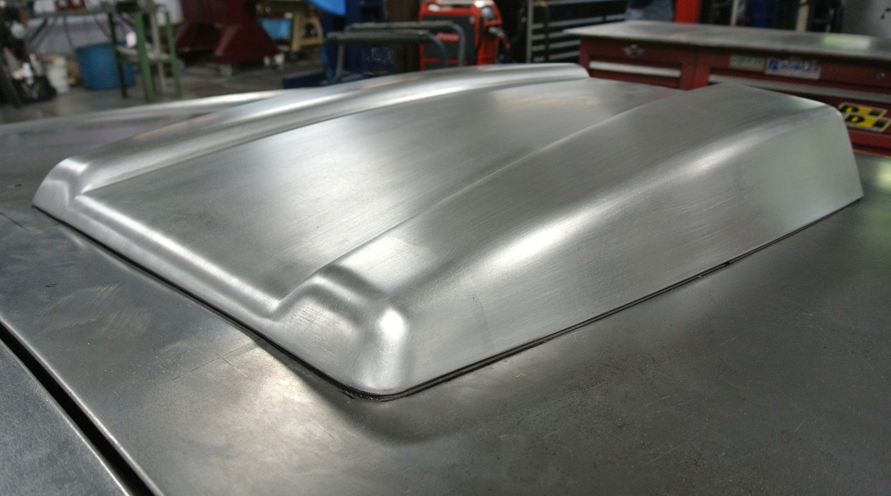 14 Completed hood scoop with refined curves and seamless integration into the hood panel design