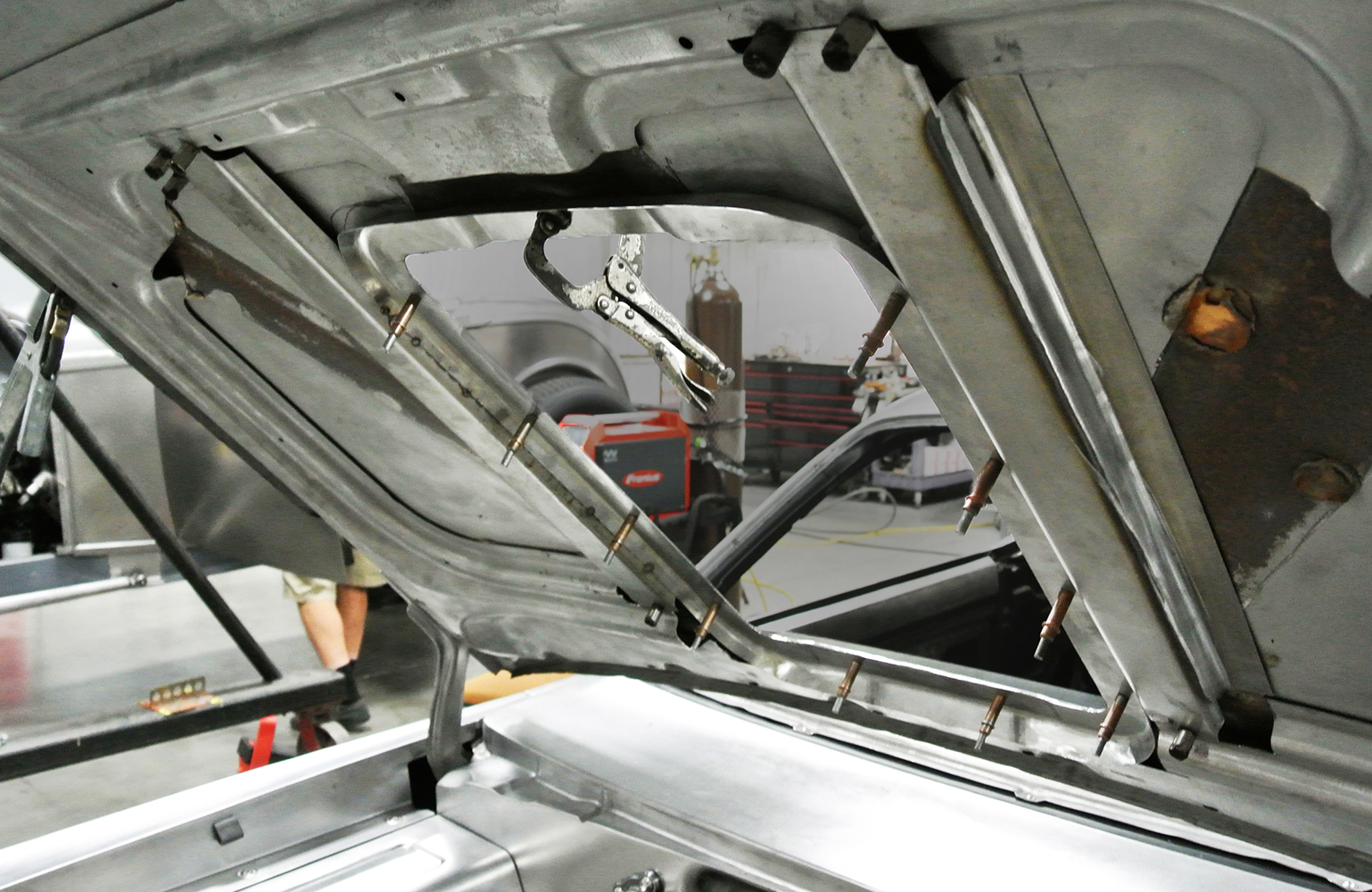16 Underside view of the hood showing clamped structural support during fabrication for added rigidity