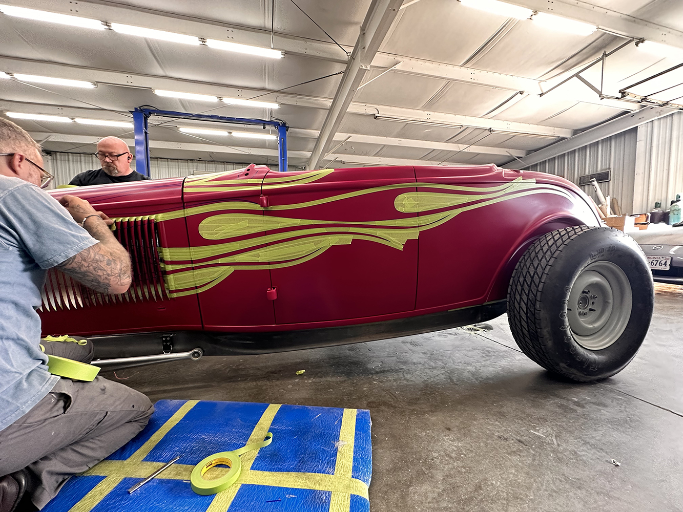 17 Side profile of the roadster with taped flame patterns being finalized for paint application