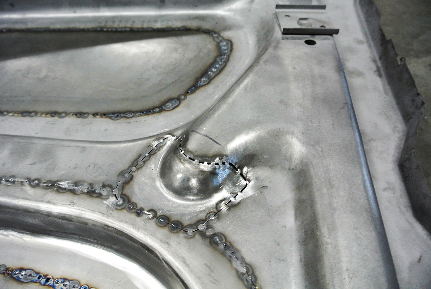 18 Close up of a repaired and welded section of the hood’s structural frame ensuring durability