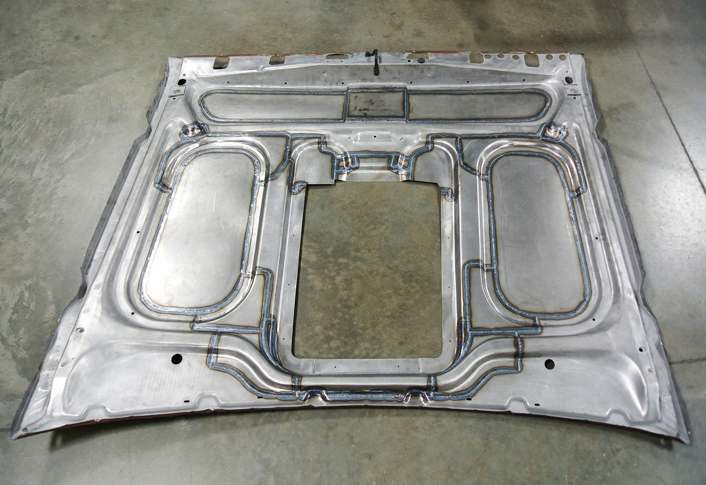 19 Full hood panel with detailed weld seams and cutout designed for compatibility with a custom engine setup