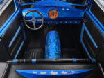 20 1928 Ford Sedan interior showcasing blue dashboard leather seats and painted nitrous tank artwork