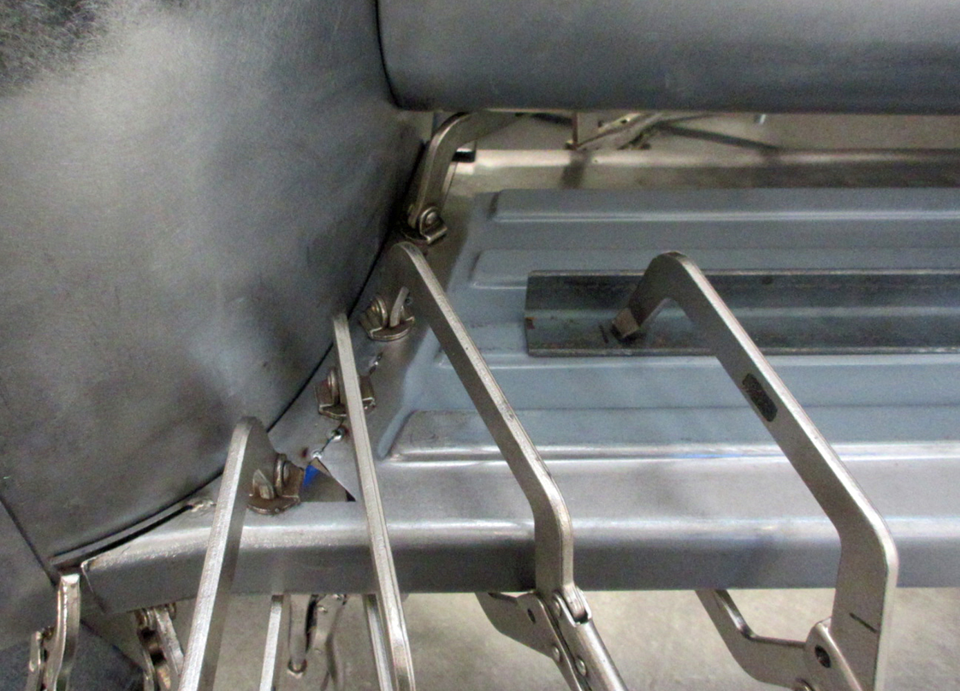 20 Ford F100 running board clamped to cab corner for alignment
