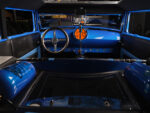 21 1928 Ford Sedan interior with custom blue dash split windshield and nitrous setup for a sleek hot rod style