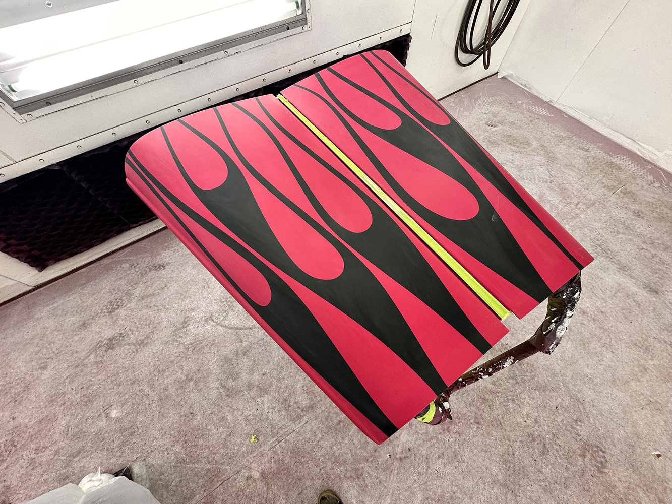 21 Hood panel painted with bold black and pink flames featuring sharp contrast and precision