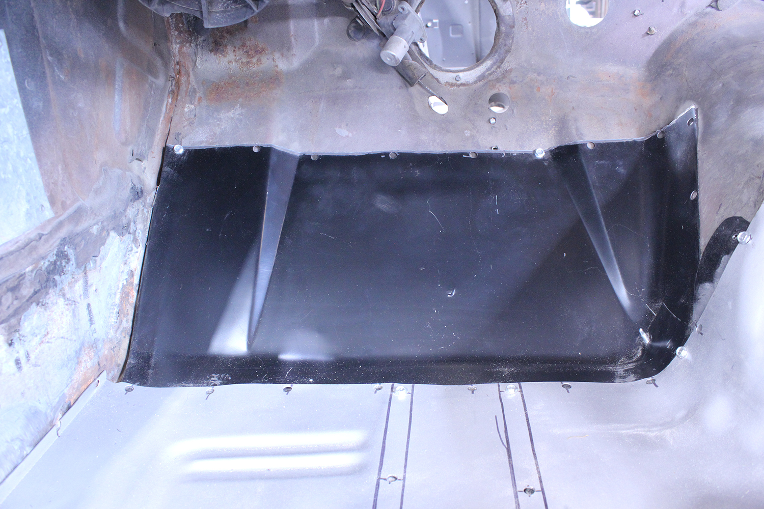 23 Detailed view of patch panel installation in the 1965 Ford Mustang firewall area