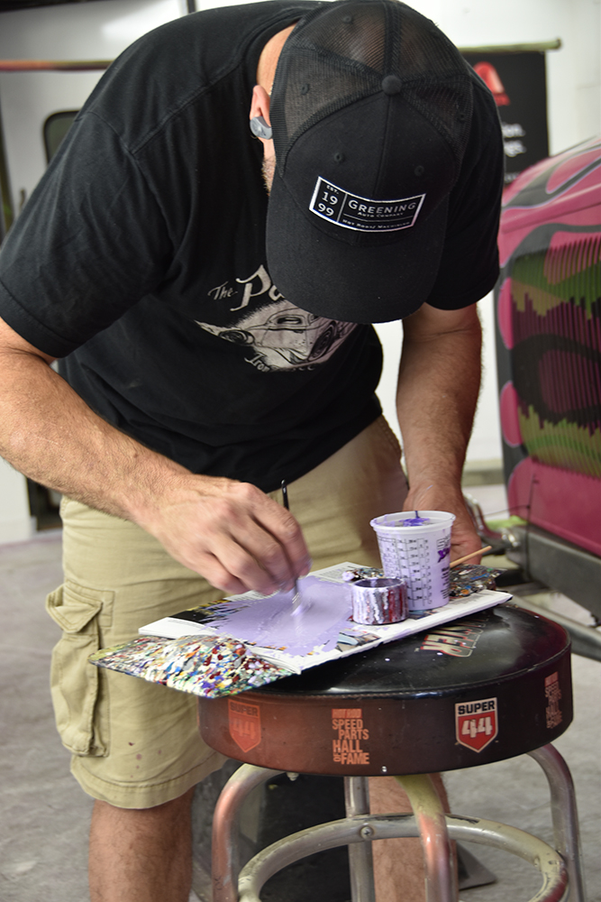 23 Painter preparing custom pinstriping paint for detailed hand applied accents