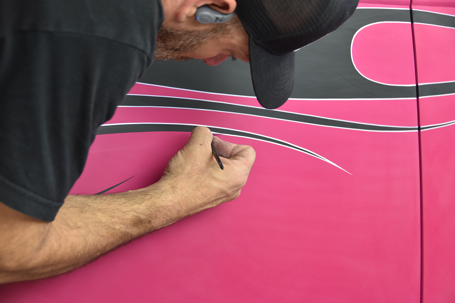 25 Close up of meticulous pinstriping work highlighting the contours of the flame design