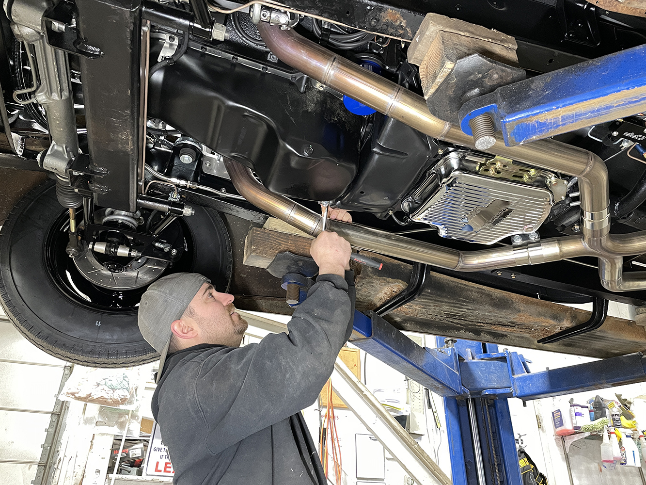 26 1946 Chevy working on bottom of transmission