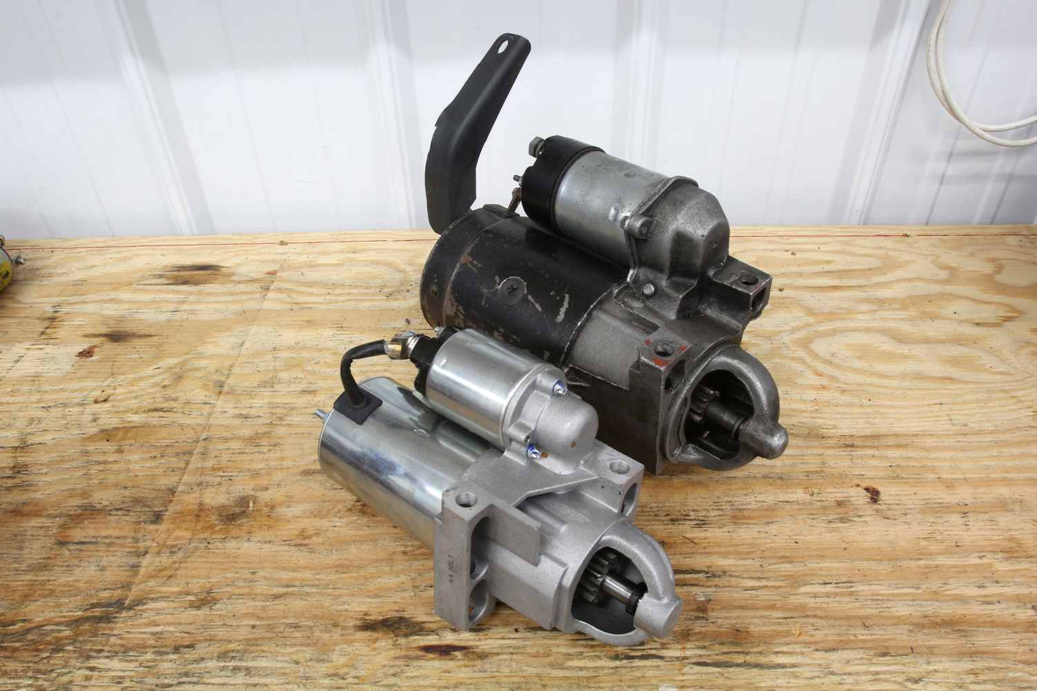 001 Comparison of a classic heavy starter motor with a lightweight modern starter