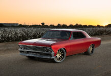 002 1966 Chevrolet Chevelle at sunset showcasing a deep red paint job modern aero enhancements and wide tires for maximum grip