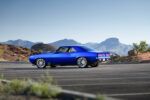 002 1969 Chevrolet Camaro rear three quarter view showcasing sleek body lines chrome accents and dual exhausts