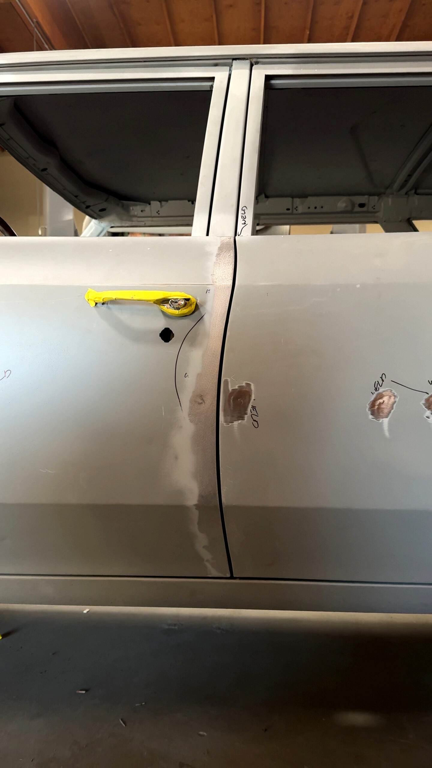 002 Close up of sanded door gaps marked for welding and alignment