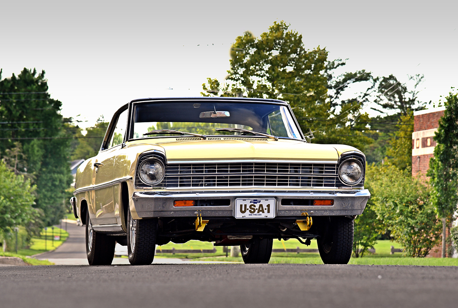 003 1967 Chevrolet Nova front view with USA 1 plate showcasing chrome grille and shining headlights
