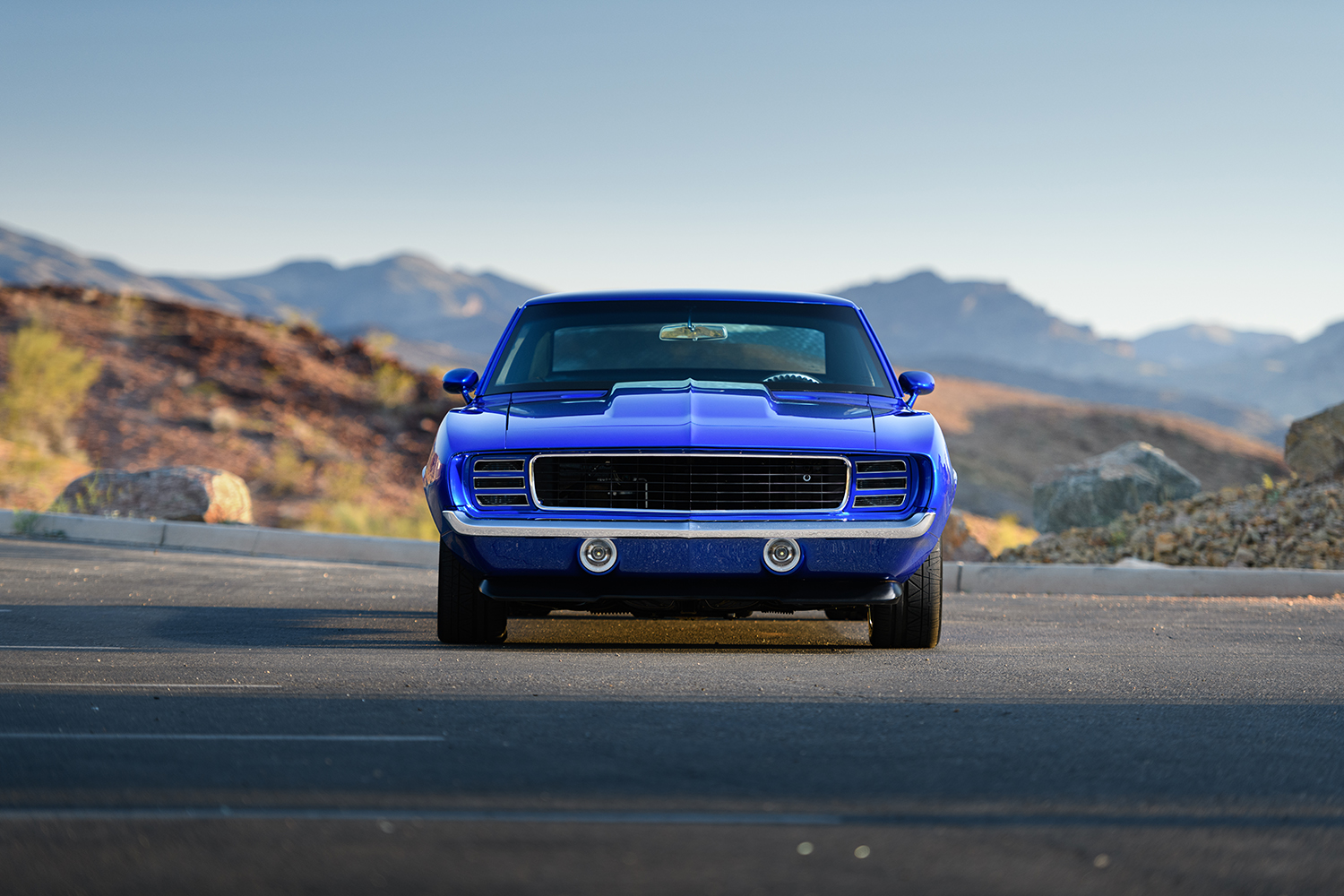 003 1969 Chevrolet Camaro front end with custom grille hood scoop and dual fog lights exuding a bold presence