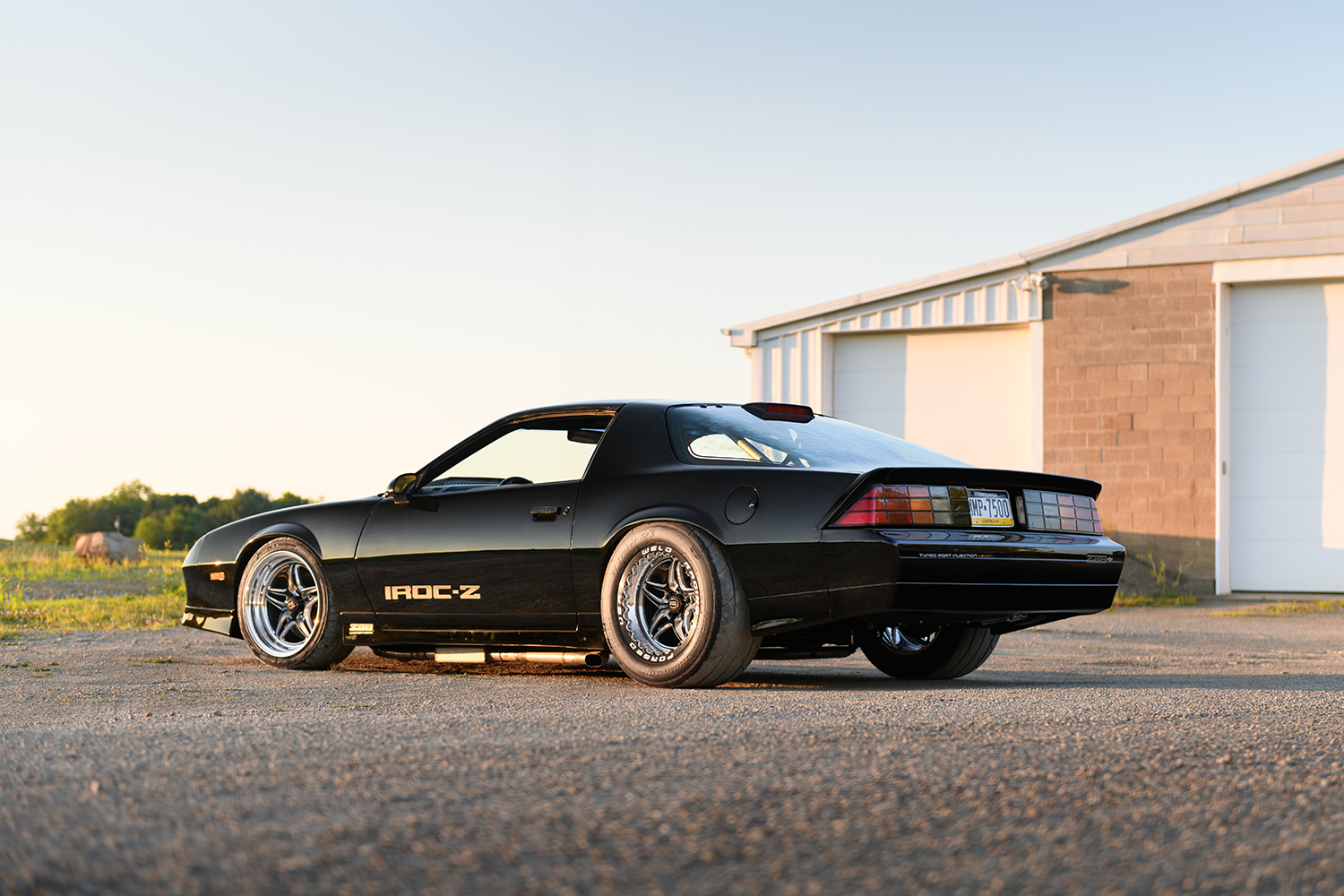 003 1986 Camaro IROC Z rear view with tinted taillights and tuned port injection badge