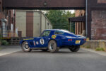 004 1966 Chevrolet Corvette blue rear three quarter view with chrome accents racing decals and dual exhausts