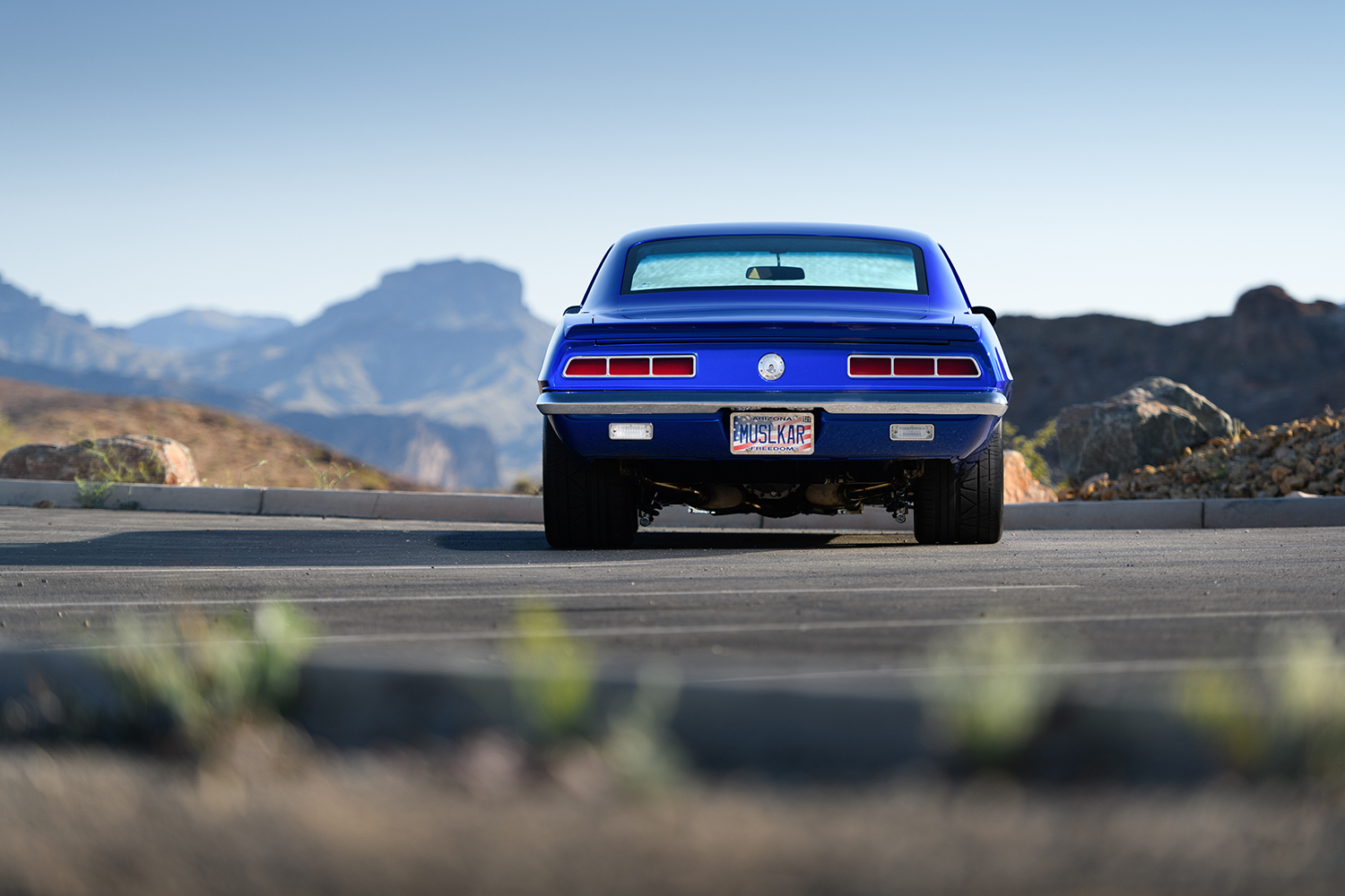 004 1969 Chevrolet Camaro rear view with taillights and Muselkar license plate perfectly highlighting its aggressive stance