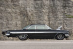 005 1961 Chevrolet Impala rear view with drag style parachute custom spoiler and triple round taillights for an all out race look