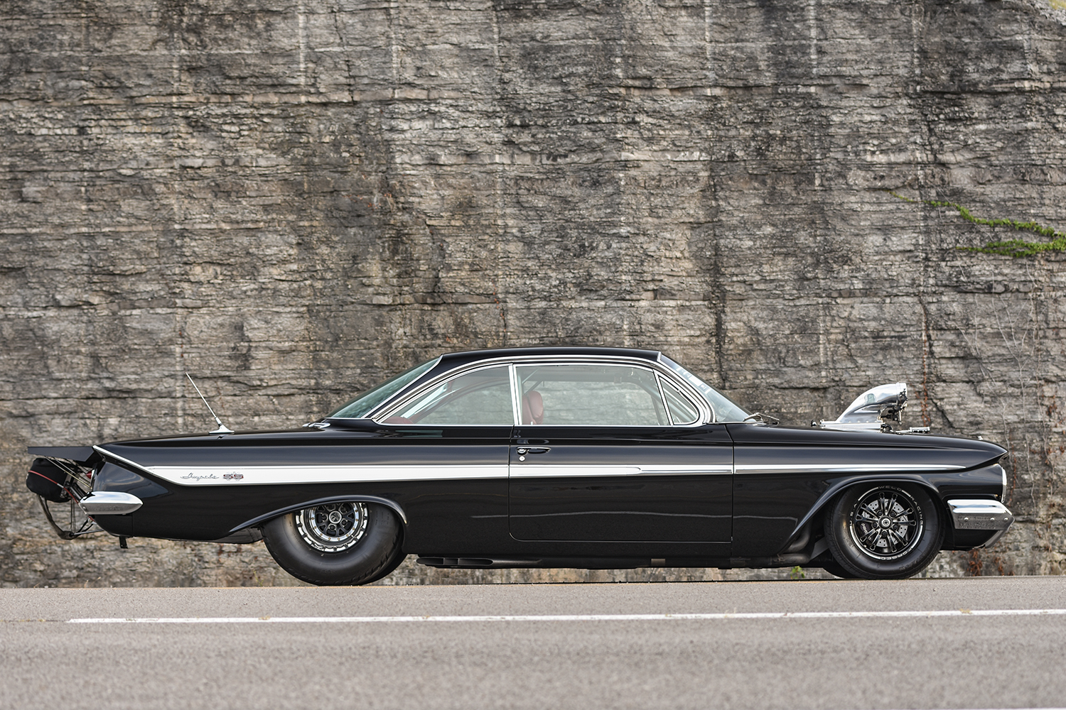 005 1961 Chevrolet Impala rear view with drag style parachute custom spoiler and triple round taillights for an all out race look