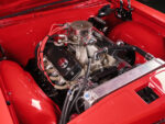 006 1965 Chevrolet Impala SS engine bay featuring a high performance V8 engine red accents and custom modifications