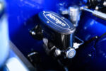 006 1969 Chevrolet Camaro Wilwood master cylinder in the engine bay showcasing upgraded braking system components