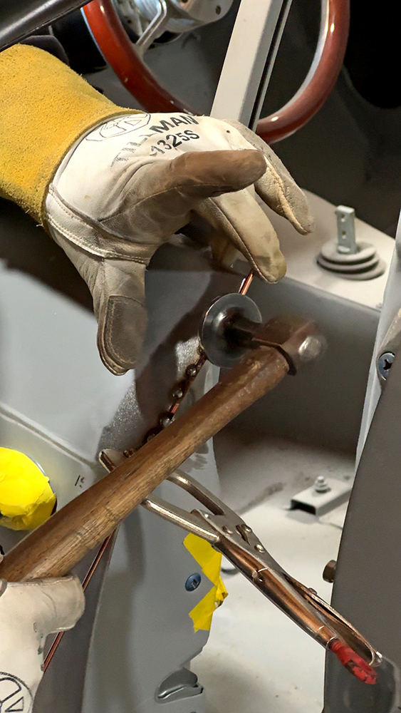 006 Refining the welds and shaping the door edges with a hammer and dolly