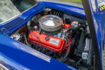 007 1966 Chevrolet Corvette close up of Traco Engineering valve cover emphasizing precision and bright red engine block